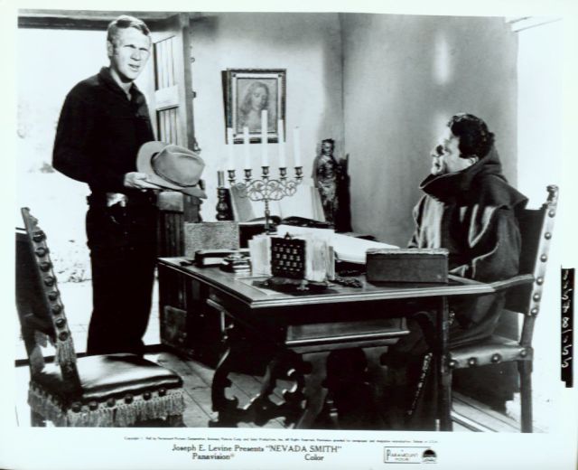 Max (McQueen) talks to the 
priest (played by Raf Vallone) 
who saved his life.